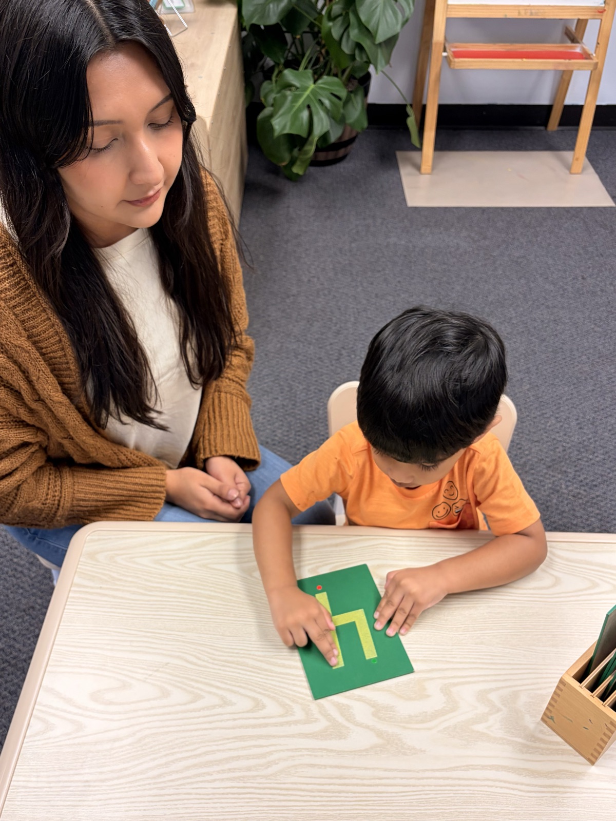 Ms. Jasmine with children in the classroom
