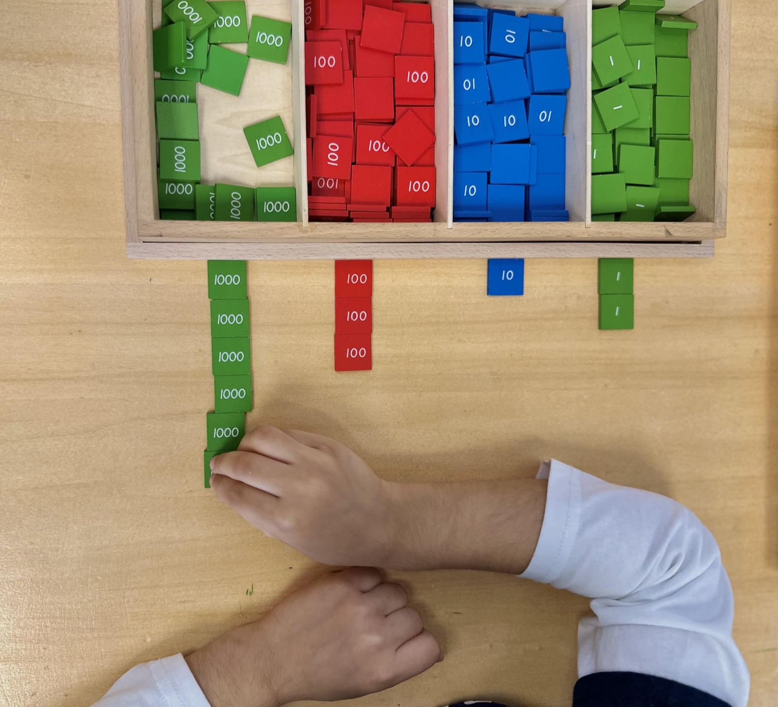 child working with the stamp game